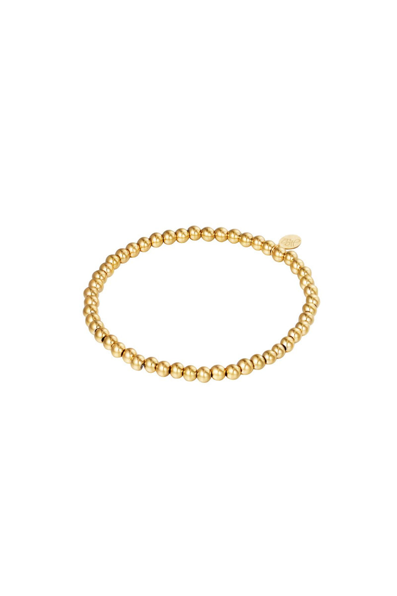 elastische armband van ronde goudkleurige kralen